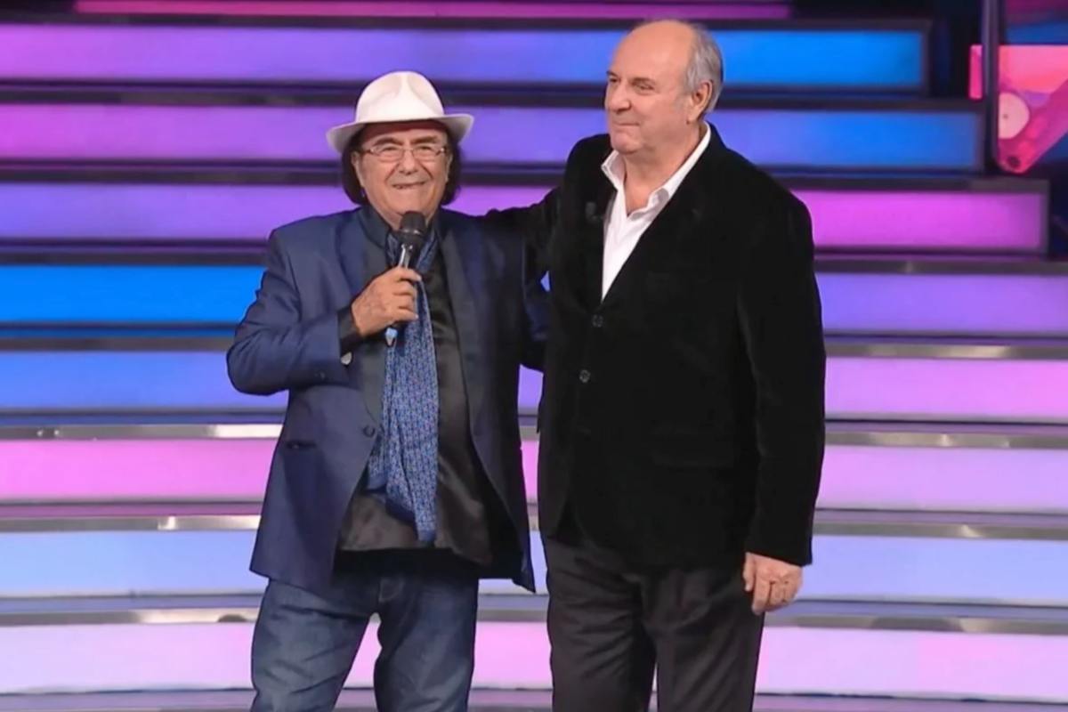 ALbano e Gerry Scotti si abbracciano