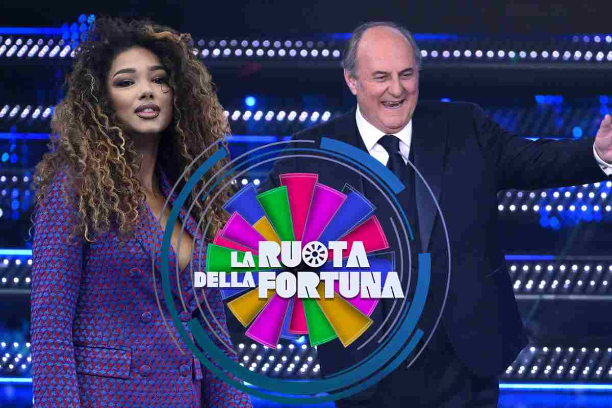 Samira Lui e Gerry Scotti ed il logo de La Ruota della Fortuna