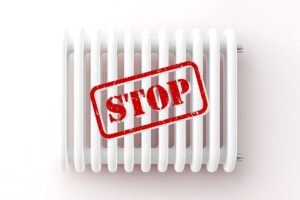 calorifero e scritta stop